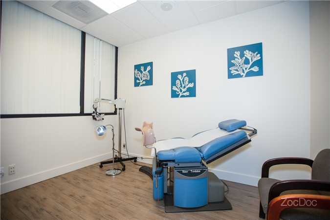 Modern exam room with blue floral art at Li Fan MD OB-GYN